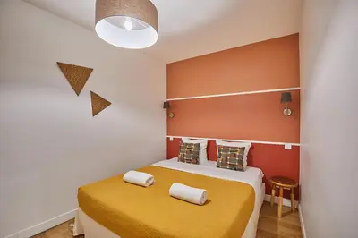 Un ou plusieurs lits dans un hébergement de l'établissement Residence Centre de Paris by Studio prestige