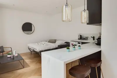 Un ou plusieurs lits dans un hébergement de l'établissement Appartement Moderne au coeur du 7ème