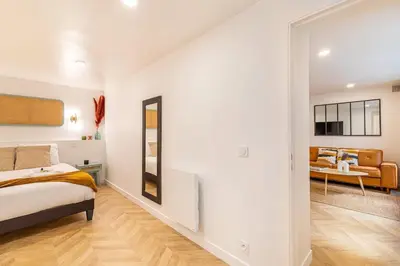Un ou plusieurs lits dans un hébergement de l'établissement Bel appartement parisien