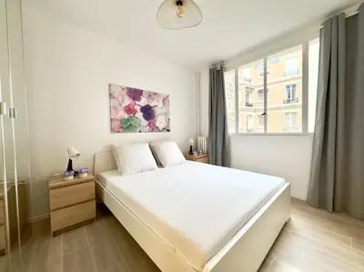 Un ou plusieurs lits dans un hébergement de l'établissement Charmant Appartement 4P Face Tour Eiffel