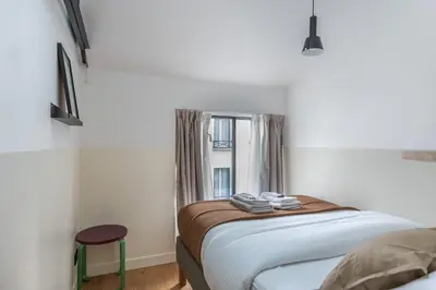 Un ou plusieurs lits dans un hébergement de l'établissement Architect Loft - 15 min from city center - 8 guests