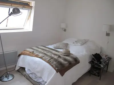 Un ou plusieurs lits dans un hébergement de l'établissement PARIS SOUS LES TOITS