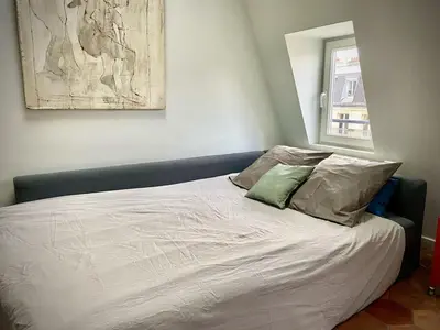 Un ou plusieurs lits dans un hébergement de l'établissement Grand Studio d’architecte proche Montmartre