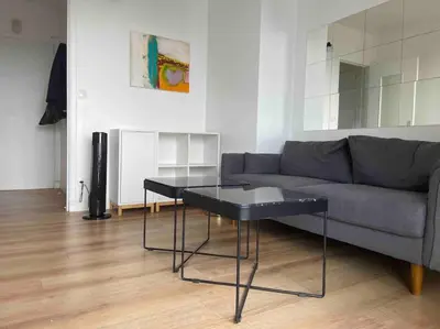 Coin salon dans l'établissement Agréable deux pièces avec loggia