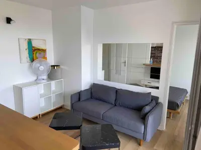 Coin salon dans l'établissement Agréable deux pièces avec loggia