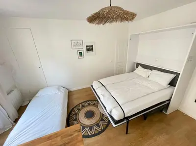 Un ou plusieurs lits dans un hébergement de l'établissement Cozy modern studio
