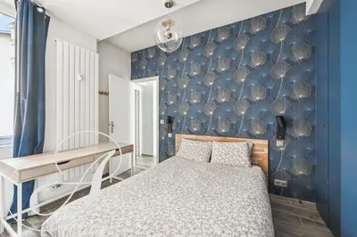 Un ou plusieurs lits dans un hébergement de l'établissement Oasis, superbe appart 3 chambres à Paris 15ème