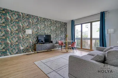 Télévision ou salle de divertissement dans l'établissement À Neuilly-sur-Seine - Le Noble - 330B