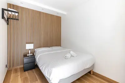 Un ou plusieurs lits dans un hébergement de l'établissement Nouvel Appartement Cosy Montparnasse