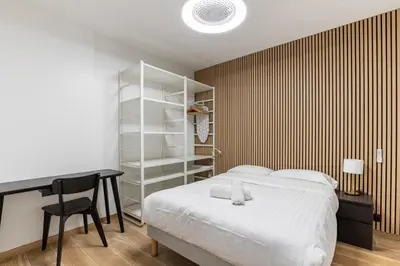 Un ou plusieurs lits dans un hébergement de l'établissement Nouvel Appartement Cosy Montparnasse