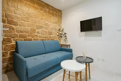 Télévision ou salle de divertissement dans l'établissement Tiny Suite 12 D Paris’s heart!