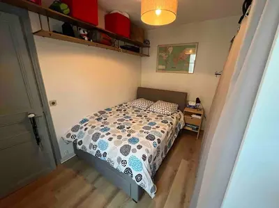 Un ou plusieurs lits dans un hébergement de l'établissement Appartement/Gobelins