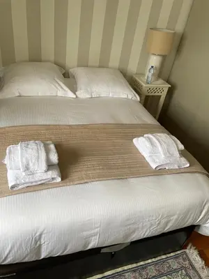 Un ou plusieurs lits dans un hébergement de l'établissement Chambre chez l'habitant avec Salle de bain à partager - homestay