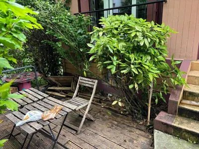 Jardin de l'établissement Pavillon 1 à 4 personnes chez l’habitant parfait pour une famille