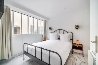 Un ou plusieurs lits dans un hébergement de l'établissement Spacious flat for 4 people #1