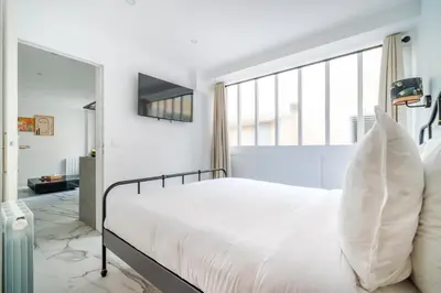 Un ou plusieurs lits dans un hébergement de l'établissement Spacious flat for 4 people #1