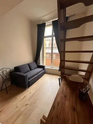 Coin salon dans l'établissement Charmant appartement de 38m² -Quartier Latin