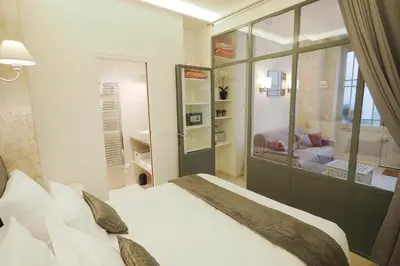 Un ou plusieurs lits dans un hébergement de l'établissement Saint germain cosy