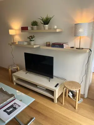Télévision ou salle de divertissement dans l'établissement Élégance aux Portes des Champs-Élysées
