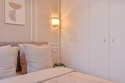 Un ou plusieurs lits dans un hébergement de l'établissement Suite Eiffel- Perfect location