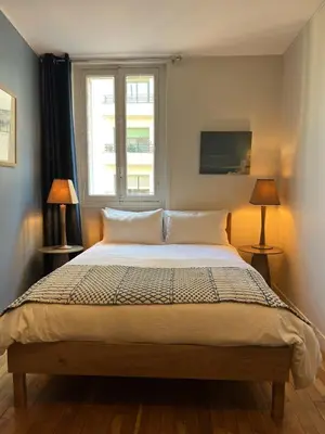 Un ou plusieurs lits dans un hébergement de l'établissement Appartement de grand standing en plein coeur de Paris à proximité du Trocadéro