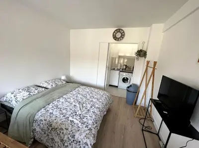 Un ou plusieurs lits dans un hébergement de l'établissement Studio cozy proche Paris