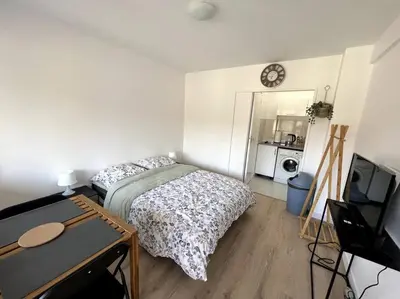 Un ou plusieurs lits dans un hébergement de l'établissement Studio cozy proche Paris