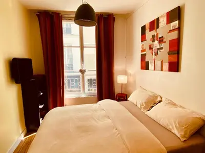Un ou plusieurs lits dans un hébergement de l'établissement Appartement Marais Cœur Historique
