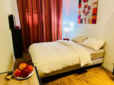 Un ou plusieurs lits dans un hébergement de l'établissement Appartement Marais Cœur Historique