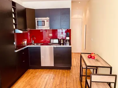 Cuisine ou kitchenette dans l'établissement Appartement Marais Cœur Historique