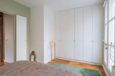 Un ou plusieurs lits dans un hébergement de l'établissement Modern Rustic-style Apartment 7th arrondissement!