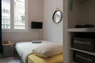 Un ou plusieurs lits dans un hébergement de l'établissement Stay in the Heart of Paris