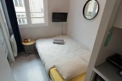 Un ou plusieurs lits dans un hébergement de l'établissement Stay in the Heart of Paris