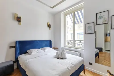 Un ou plusieurs lits dans un hébergement de l'établissement Apartment Bastille Le Marais by Studio prestige