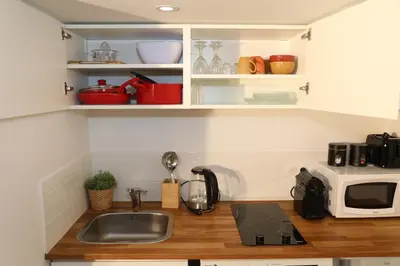 Cuisine ou kitchenette dans l'établissement Eiffel Tour - Cosy Manéo