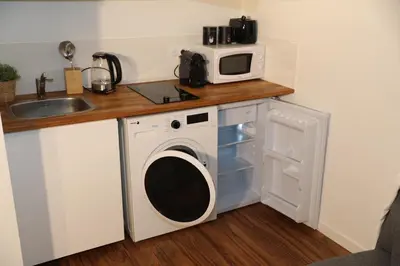 Cuisine ou kitchenette dans l'établissement Eiffel Tour - Cosy Manéo