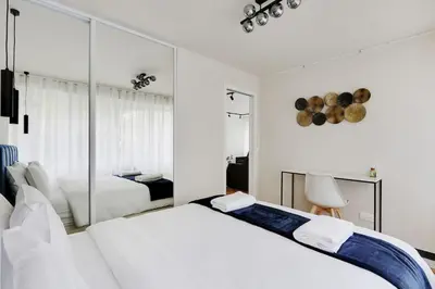 Un ou plusieurs lits dans un hébergement de l'établissement Appartement Cosy pour 4 à La Villette - Paris