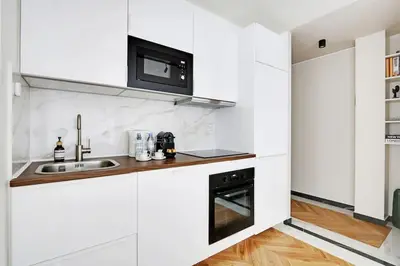 Cuisine ou kitchenette dans l'établissement Appartement Cosy pour 4 à La Villette - Paris
