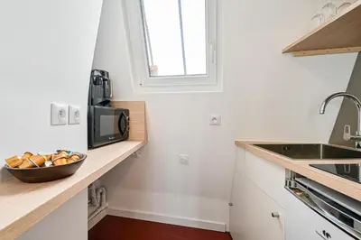 Cuisine ou kitchenette dans l'établissement Le Cœur Sacré - 4 personnes Montmartre - Wifi