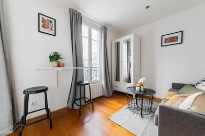 Un ou plusieurs lits dans un hébergement de l'établissement Cosy Apt Batignoles