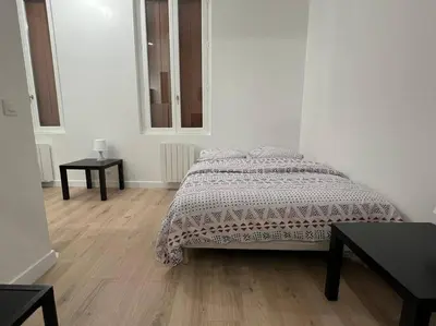 Un ou plusieurs lits dans un hébergement de l'établissement Superbe appartement proche Paris