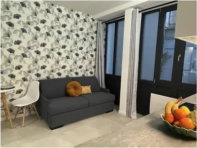 Coin salon dans l'établissement Modern Studio Apt In The Heart Of Paris