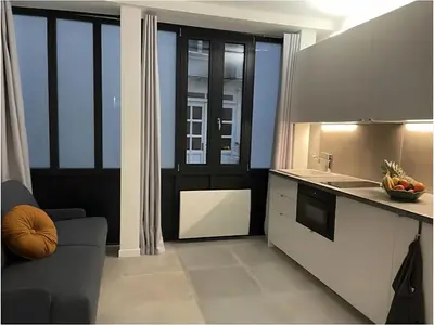 Cuisine ou kitchenette dans l'établissement Modern Studio Apt In The Heart Of Paris