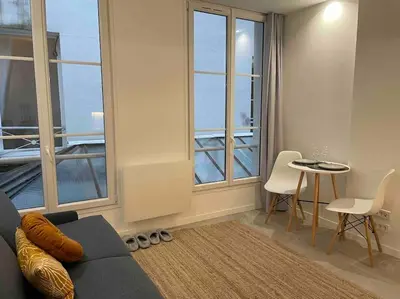 Coin salon dans l'établissement Cozy Studio In The Heart Of Paris