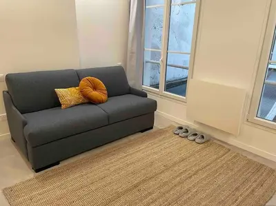 Coin salon dans l'établissement Cozy Studio In The Heart Of Paris