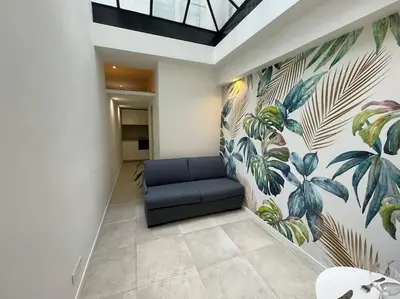 Coin salon dans l'établissement Bright studio apartment in the heart of Paris