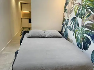 Un ou plusieurs lits dans un hébergement de l'établissement Bright studio apartment in the heart of Paris