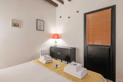Un ou plusieurs lits dans un hébergement de l'établissement Spacious apartment - 2BR-6P - Bastille