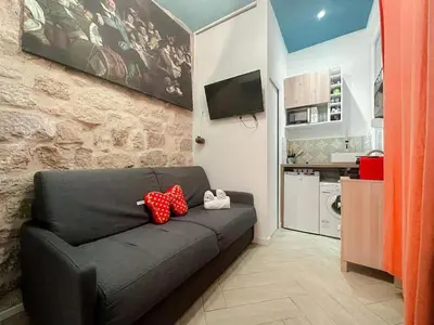 Cuisine ou kitchenette dans l'établissement Charming Studio in the center of Paris