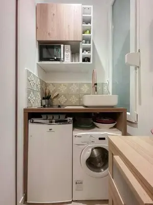 Cuisine ou kitchenette dans l'établissement Charming Studio in the center of Paris
